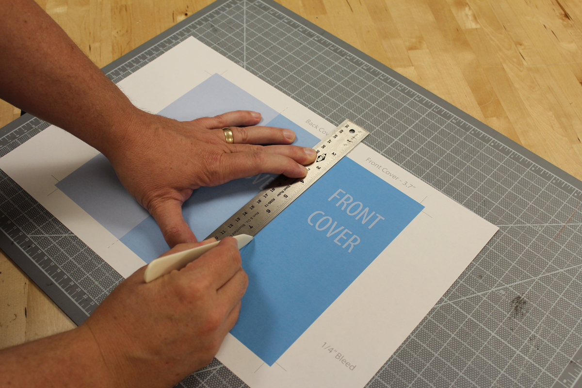 Photo showing how to trim a brochure.