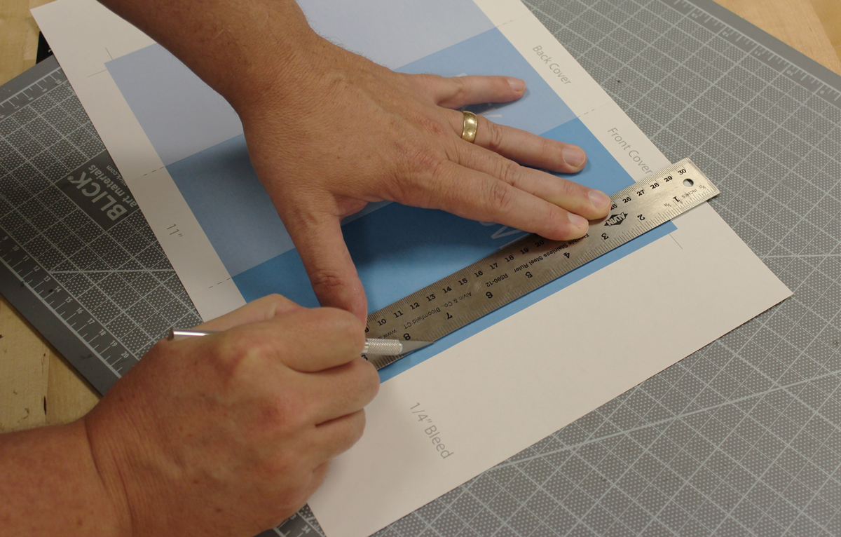 Photo showing how to trim a brochure.