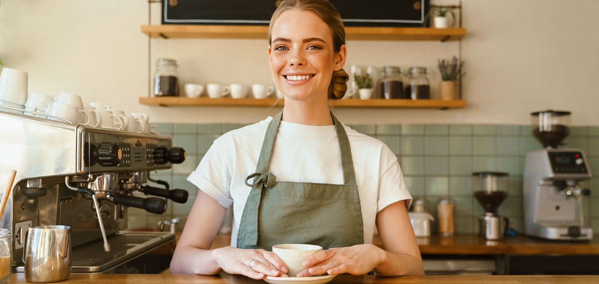 Photo of a woman in a coffee shop.