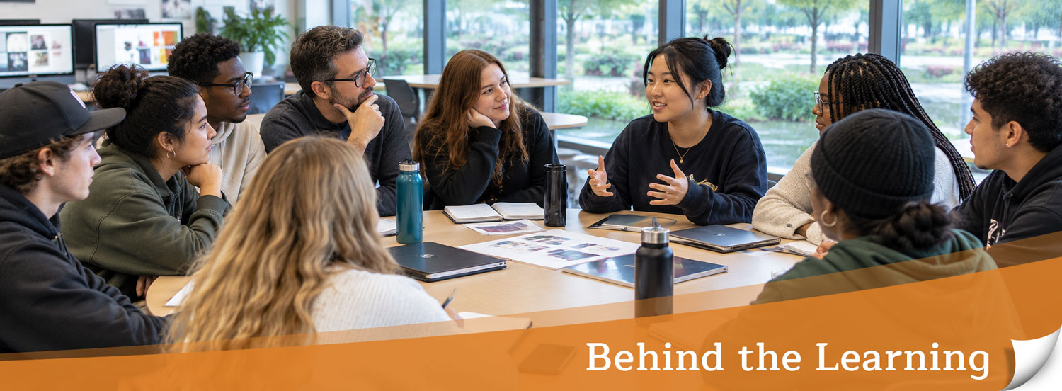 Header image showing a teacher and a group of students sitting around a table talking.